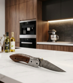 Artisan Damascus Steel Folding Knife with Premium Rosewood Handle & Navy Blue Leather Sheath
